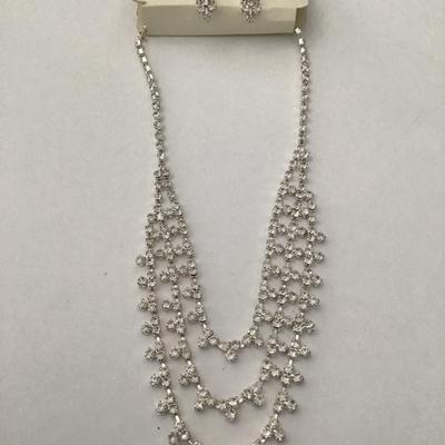 Beautiful rhinestone, silver toned statement, necklace, and earring set