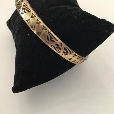 Super cool, gold toned triangle bangle bracelet