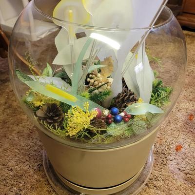 Terrarium with flower arrangement