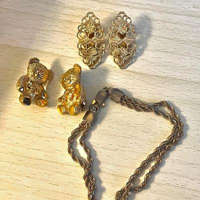 Gold toned clip on earrings and bracelet