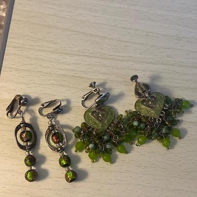 Silver toned green clip on earrings