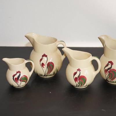 GROUPING OF FOUR WATT WARE ROOSTER PITCHERS. #62, #15, #15, #16