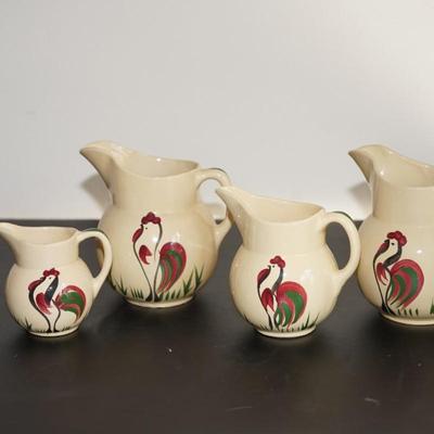 GROUPING OF FOUR WATT WARE ROOSTER PITCHERS. #62, #15, #15, #16