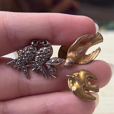 Silver and gold toned pins