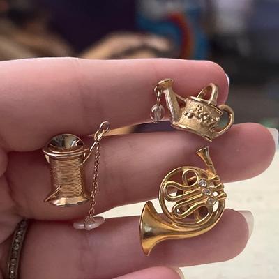 Gold toned pins