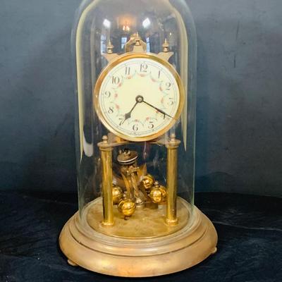 LOT 31: Set of Three (3) Mechanical Glass Dome Anniversary Clocks Featuring John Wanamaker, Forestville German Made Clock and a Smaller...