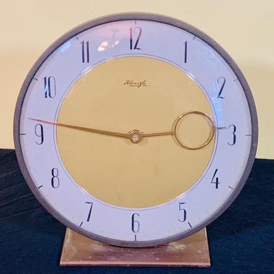 LOT 35: Art Deco Style Wind-up Mechanical Kienzle Brass Desk Clock and a White Ceramic MCM Table Lamp with Teal Colored Shade