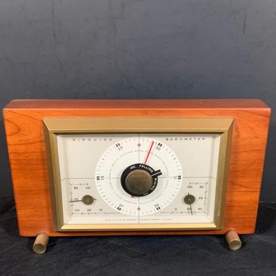 LOT 43: Collection of Wood Mounted Clock, Barometer and Thermometers Including Junghans Battery Desk Clock, Airguide Barometer, and More