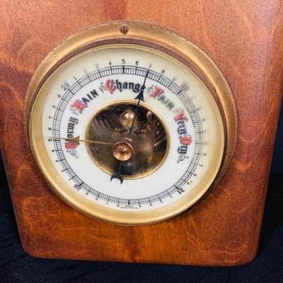LOT 43: Collection of Wood Mounted Clock, Barometer and Thermometers Including Junghans Battery Desk Clock, Airguide Barometer, and More