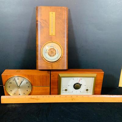LOT 43: Collection of Wood Mounted Clock, Barometer and Thermometers Including Junghans Battery Desk Clock, Airguide Barometer, and More