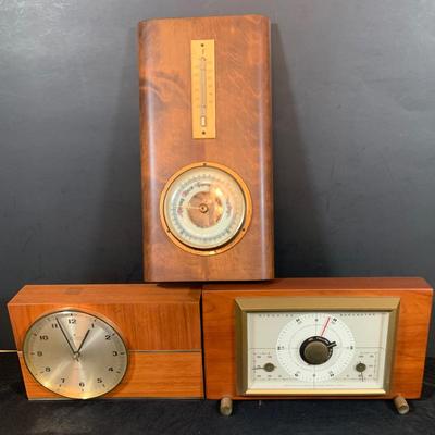 LOT 43: Collection of Wood Mounted Clock, Barometer and Thermometers Including Junghans Battery Desk Clock, Airguide Barometer, and More
