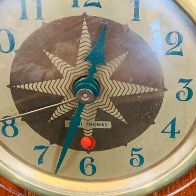 LOT 44 Seth Thomas Electric Ships Wheel Clock, a Park Sherman Cigarette Dispenser Ship’s Wheel Clock and a Versailles Barometer