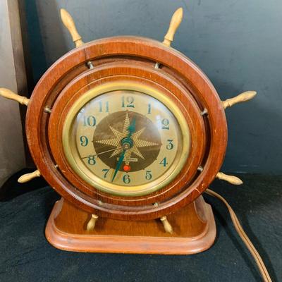 LOT 44 Seth Thomas Electric Ships Wheel Clock, a Park Sherman Cigarette Dispenser Ship’s Wheel Clock and a Versailles Barometer