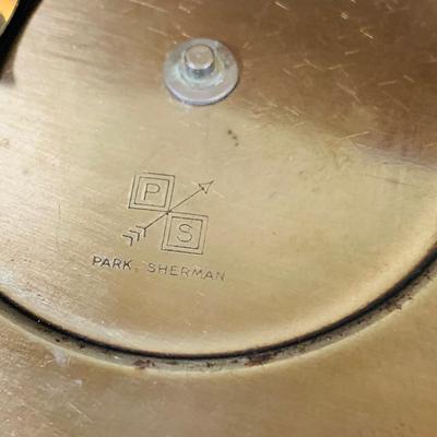 LOT 44 Seth Thomas Electric Ships Wheel Clock, a Park Sherman Cigarette Dispenser Ship’s Wheel Clock and a Versailles Barometer