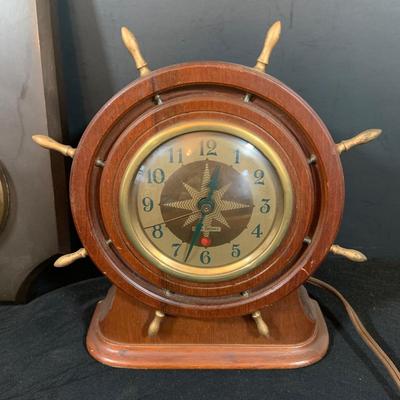 LOT 44 Seth Thomas Electric Ships Wheel Clock, a Park Sherman Cigarette Dispenser Ship’s Wheel Clock and a Versailles Barometer