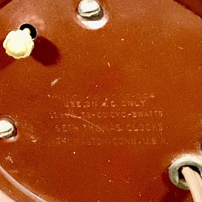 LOT 44 Seth Thomas Electric Ships Wheel Clock, a Park Sherman Cigarette Dispenser Ship’s Wheel Clock and a Versailles Barometer