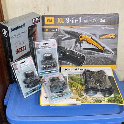LOT 62: CAT XL 9 in 1 Multi Tool Set, Bushnell Rechargeable Flashlight, National Geographic Binoculars and Three Swivel Lens Headlamps...