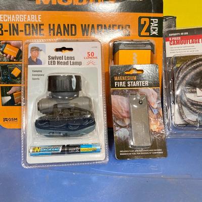 LOT 63: New in Package and More - Muddy Hand Warmers, Pruning Saw, Manna Straws, Swivel Lens Head Lamp, Stretch Cords and Fire Starter