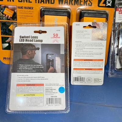 LOT 63: New in Package and More - Muddy Hand Warmers, Pruning Saw, Manna Straws, Swivel Lens Head Lamp, Stretch Cords and Fire Starter