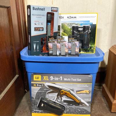 LOT 66: Bushnell Rechargeable Flashlight, CAT XL 9 in 1 Multi-Tool Set, National Geographic Binoculars and Three Magnesium Fire Starters...