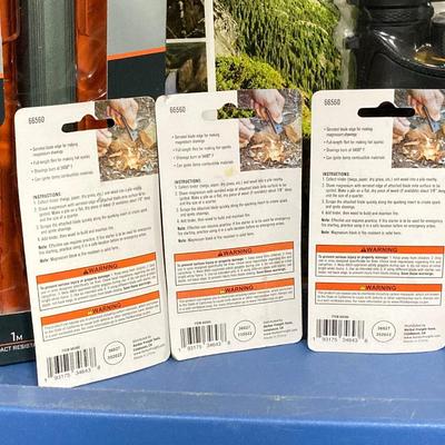 LOT 66: Bushnell Rechargeable Flashlight, CAT XL 9 in 1 Multi-Tool Set, National Geographic Binoculars and Three Magnesium Fire Starters...