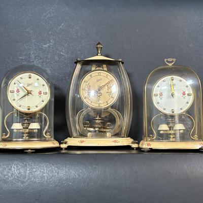 LOT 89: Collection of Schaltz Anniversary Clocks: 400-Day, Plastic Domes, Untested