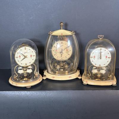 LOT 89: Collection of Schaltz Anniversary Clocks: 400-Day, Plastic Domes, Untested