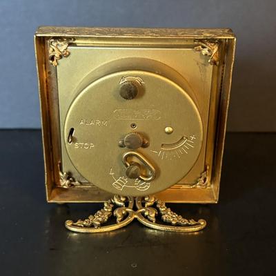 LOT 104: Vintage Imexal 18 Jewel 8-day World Clock, Florn Travel Alarm Clock, Bulova Swiss Made Alarm & Wooden Wall Barometer Made in...