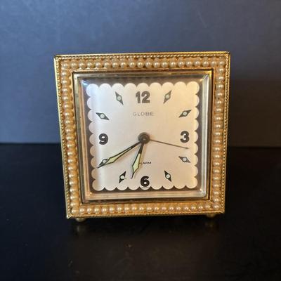 LOT 104: Vintage Imexal 18 Jewel 8-day World Clock, Florn Travel Alarm Clock, Bulova Swiss Made Alarm & Wooden Wall Barometer Made in...