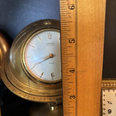 LOT 104: Vintage Imexal 18 Jewel 8-day World Clock, Florn Travel Alarm Clock, Bulova Swiss Made Alarm & Wooden Wall Barometer Made in...