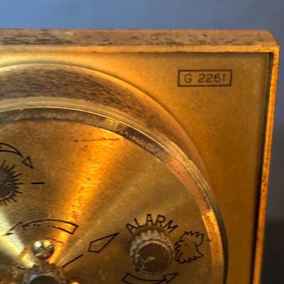 LOT 104: Vintage Imexal 18 Jewel 8-day World Clock, Florn Travel Alarm Clock, Bulova Swiss Made Alarm & Wooden Wall Barometer Made in...