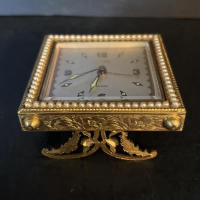 LOT 104: Vintage Imexal 18 Jewel 8-day World Clock, Florn Travel Alarm Clock, Bulova Swiss Made Alarm & Wooden Wall Barometer Made in...