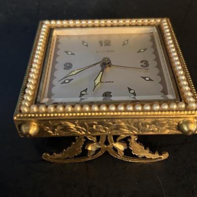 LOT 104: Vintage Imexal 18 Jewel 8-day World Clock, Florn Travel Alarm Clock, Bulova Swiss Made Alarm & Wooden Wall Barometer Made in...