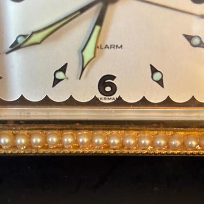 LOT 104: Vintage Imexal 18 Jewel 8-day World Clock, Florn Travel Alarm Clock, Bulova Swiss Made Alarm & Wooden Wall Barometer Made in...