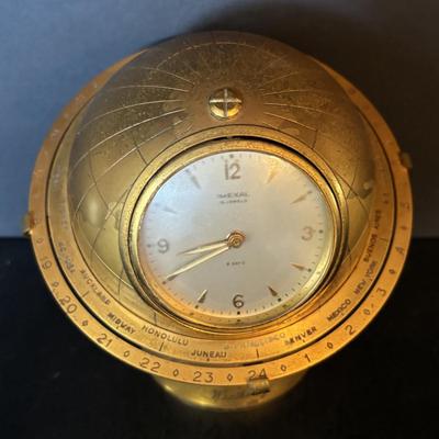 LOT 104: Vintage Imexal 18 Jewel 8-day World Clock, Florn Travel Alarm Clock, Bulova Swiss Made Alarm & Wooden Wall Barometer Made in...