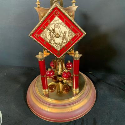 LOT 168; Collection of Two (2) Glass Domed Anniversary Clocks - Red Diamond Faced Clock by Schatz and Cooper Colored Clocky by...