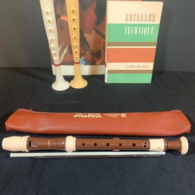 LOT 176: Vintage Wind Instruments Including Two (2) Flutophones, an Aulos Soprano Recorder, Sheffield Recorder, Slide Whistle and Books