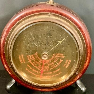 LOT 177: Vintage Banjo Style Techron Nautical Themed Electric Wall Clock Ship’s Wheel Barometer and Vintage Selsi Forecaster Barometer