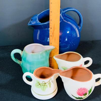 LOT 188: Collection of Stangl Pottery. Creamers and a Large Blue Ceramic Pitcher