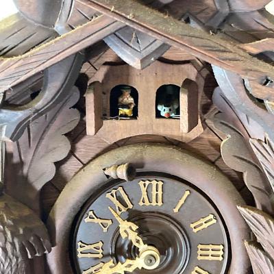 LOT 244: Cuendet Musical Movement Cuckoo Clock "Die Muhle Im Schwarzwald Holzhackerub'n Marsch 3695-96"
