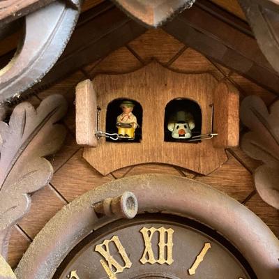 LOT 244: Cuendet Musical Movement Cuckoo Clock "Die Muhle Im Schwarzwald Holzhackerub'n Marsch 3695-96"