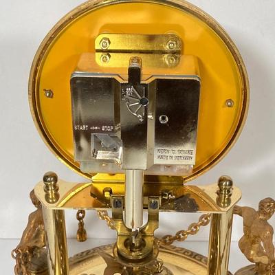 LOT 247: Vintage Kern Suhne Anniversary Figural Clock