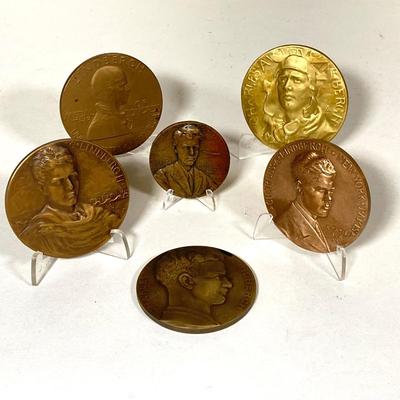 LOT 261: Collection of Six Charles Lindberg Commemorative Tokens / Medals