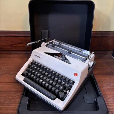 LOT 280: Olympia Typewriter, Made in W. Germany w/Carrying Case