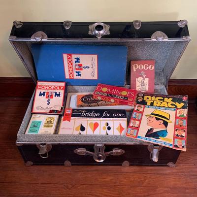 LOT 291: Black Steamer Trunk Loaded with Vintage Toys and Books Including Monopoly, Cribbage and More