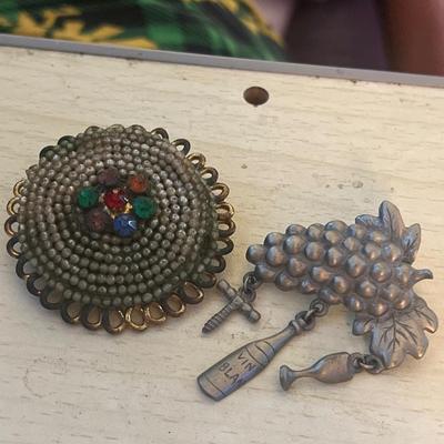 Gold and silver toned pins