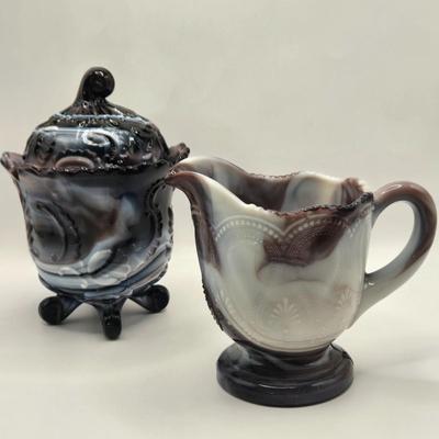 LOT 22L: Purple Slag Imperial Glass Footed Sugar Bowl with Lid and Slag Glass Creamer