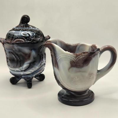 LOT 22L: Purple Slag Imperial Glass Footed Sugar Bowl with Lid and Slag Glass Creamer