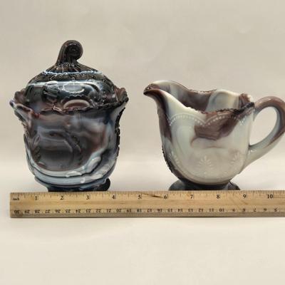 LOT 22L: Purple Slag Imperial Glass Footed Sugar Bowl with Lid and Slag Glass Creamer