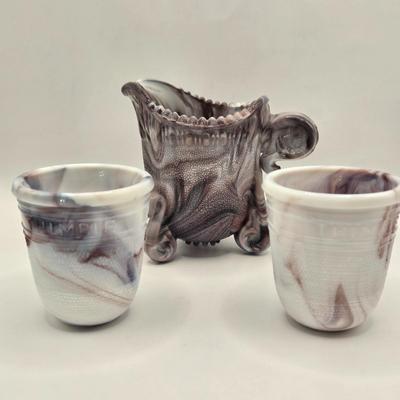 LOT 26L: Two Just a Thimble Full Purple Slag Shot/Jigger Glasses, and Small Pitcher/Creamer